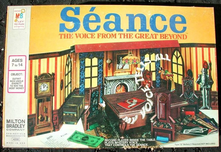 Image of the board game box, which shows an old english-looking room with a grandfather clock, suit of armor, fireplace, and red and yellow wallpaper, plus other gameplay items.
